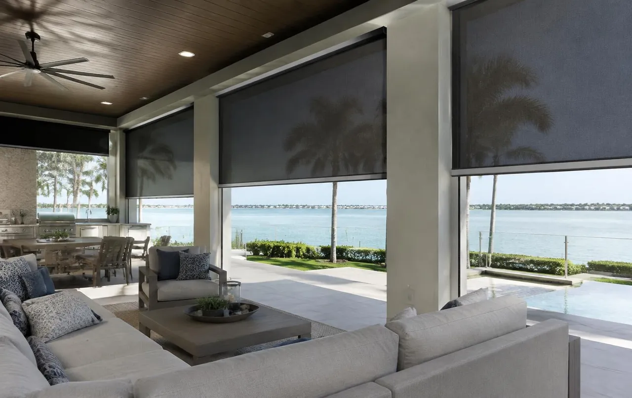Retractable motorized screens on a covered outdoor living area